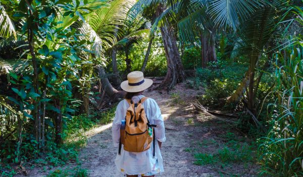Anse Cocos beach, La Digue Island, Seyshelles, woman on vacation Seychelles. young Asian girl on the beach